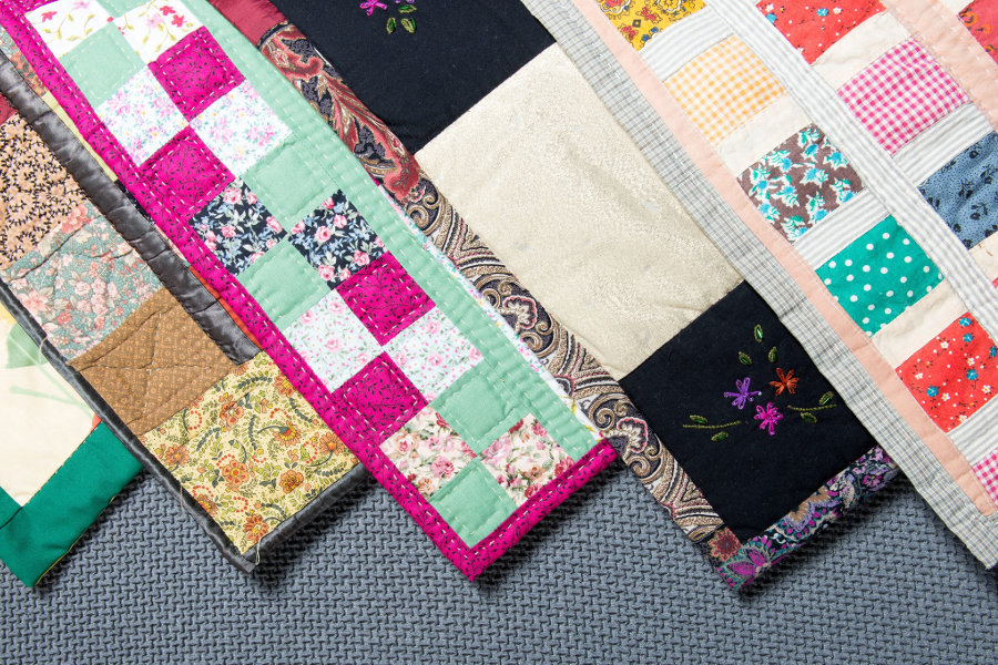 Colorful patchwork quilts handmade by the quilting ministry of St. John Lutheran Church Cat Spring.