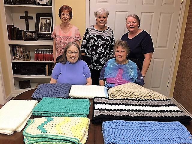 Members of the quilting ministry at St. John Lutheran Church Cat Spring working on handmade quilts.